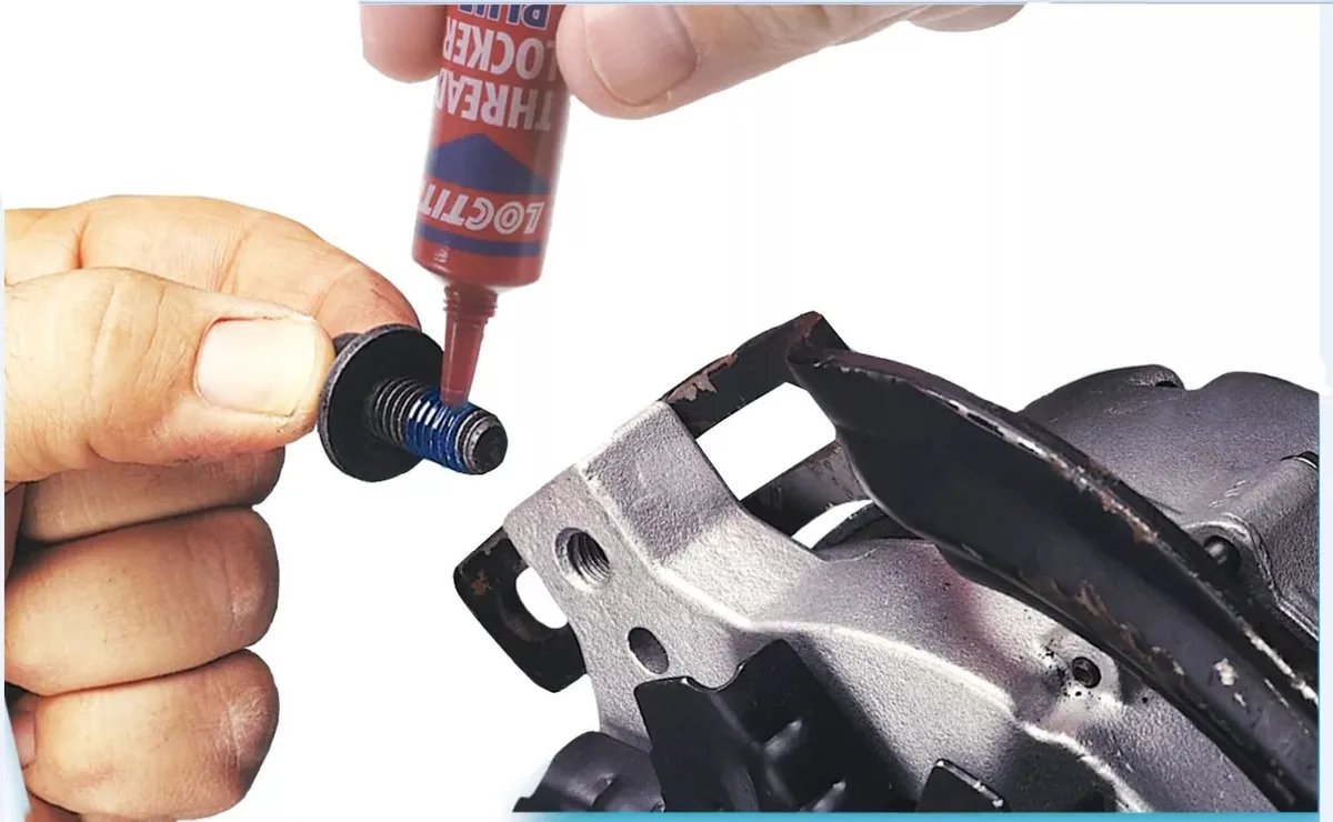 applying threadlocker to bolt threads